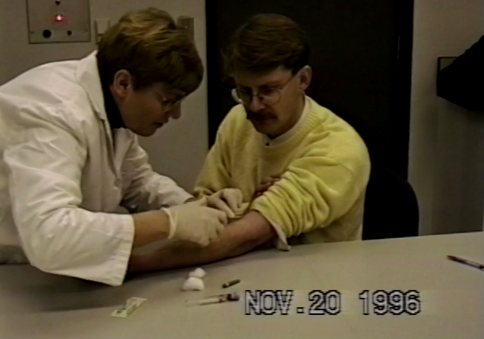 Dr. John Schneeberger giving blood from arm