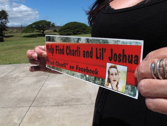 Searchers with a Find Charli sign