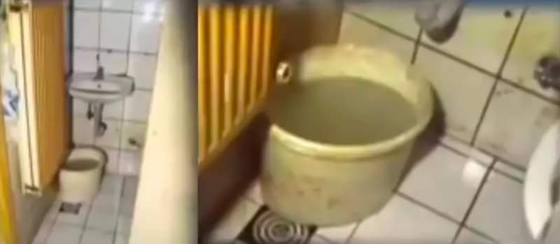 Bucket in prison cell