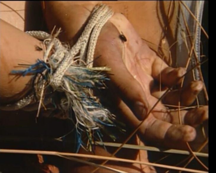 Distinctive rope binding his hands