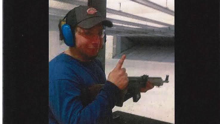 Khalil Abu Rayyan with a rifle at a shooting range