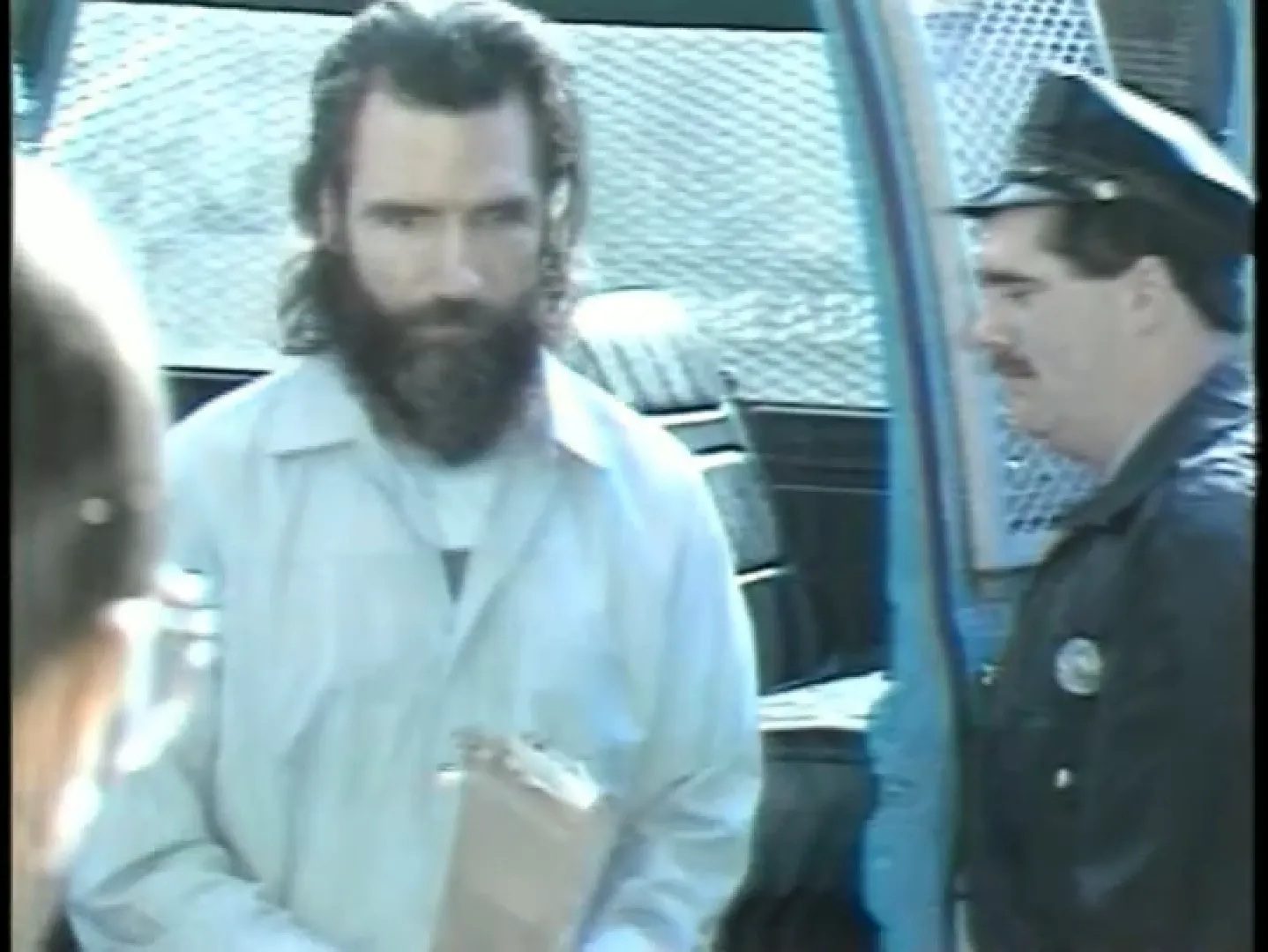 Gary Heidnik led to a police van