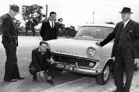 Detectives with Eric Edgar Cooke after his arrest in 1963